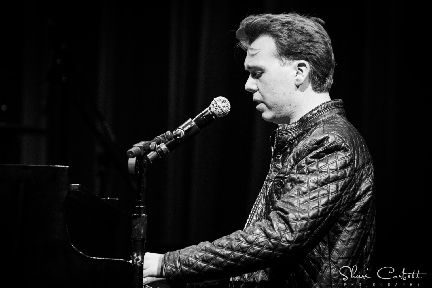 Nick Davies at the piano, black and white
