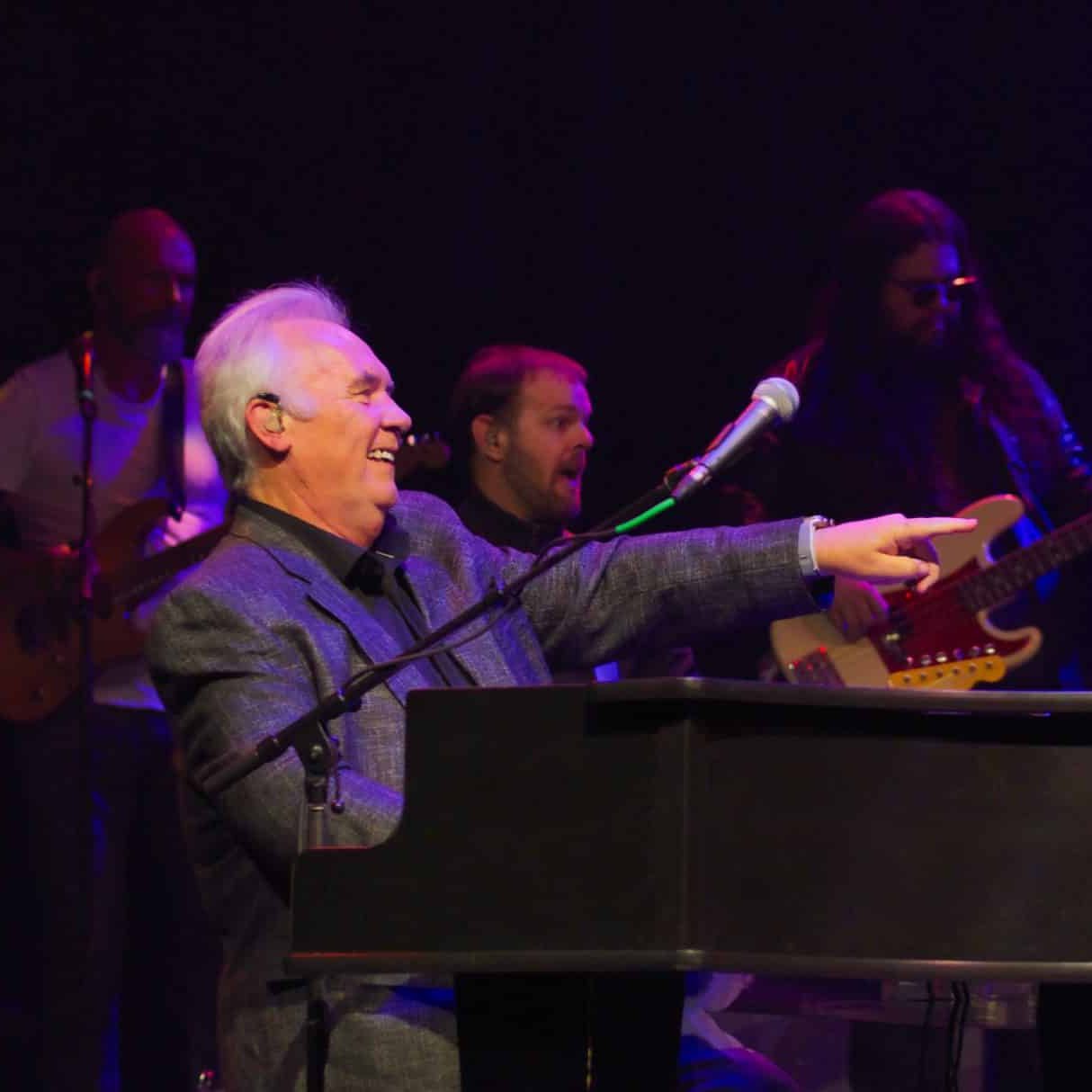 Terry Davies laughing at the piano